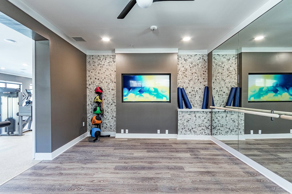the retreat at thousand oaks fitness room with tv and exercise equipment