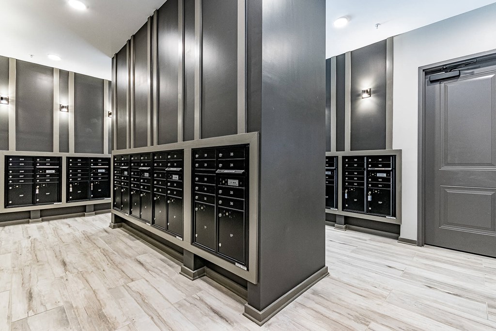 a spacious room with many lockers and a door