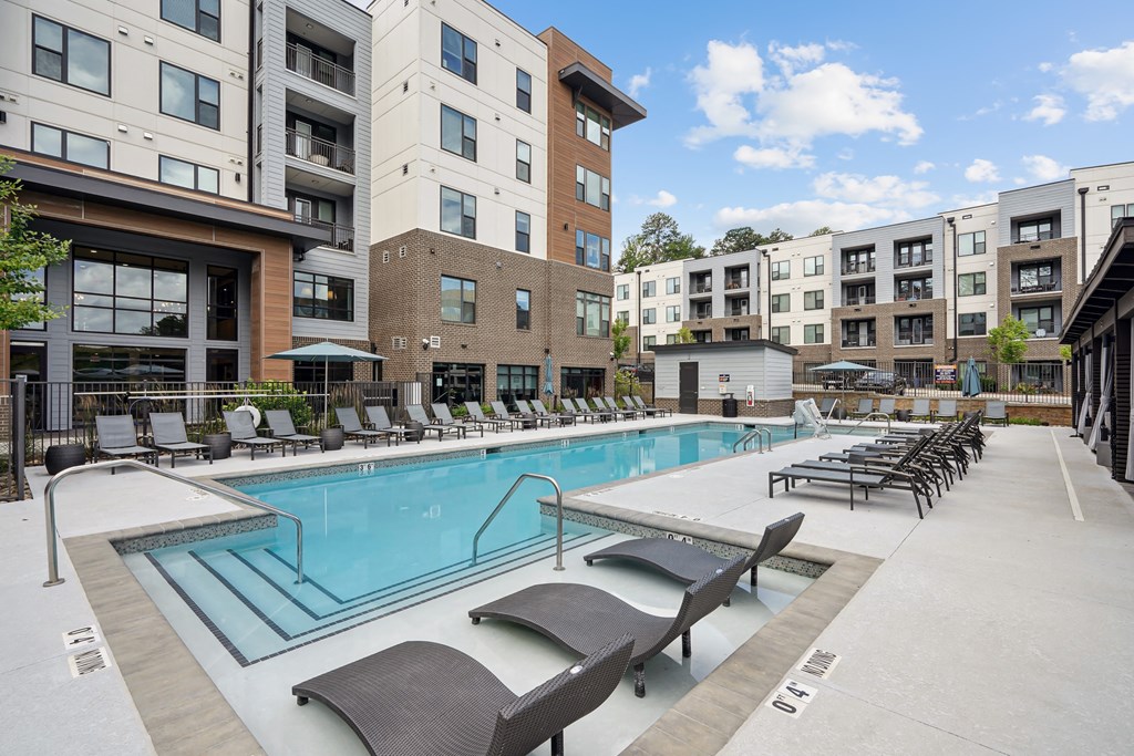 our apartments have a large swimming pool with lounge chairs