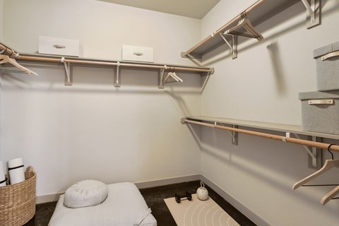 a spa room with a massage bed and shelves on the wall