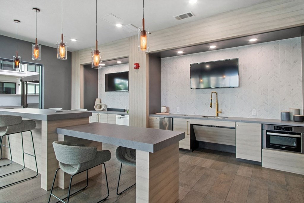 a kitchen with a large island and a dining table