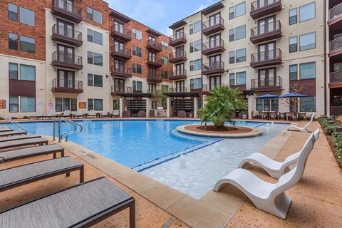 Large pool with seating and cabanas