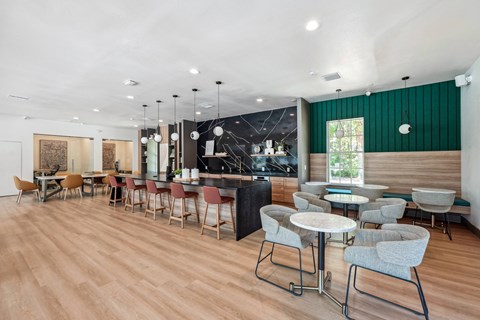 A room with a long table and chairs.