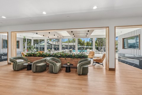 A large room with a long table and chairs.