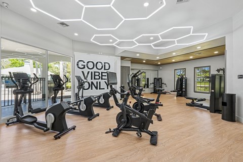 A gym with a sign that says "Good Vibe Only".