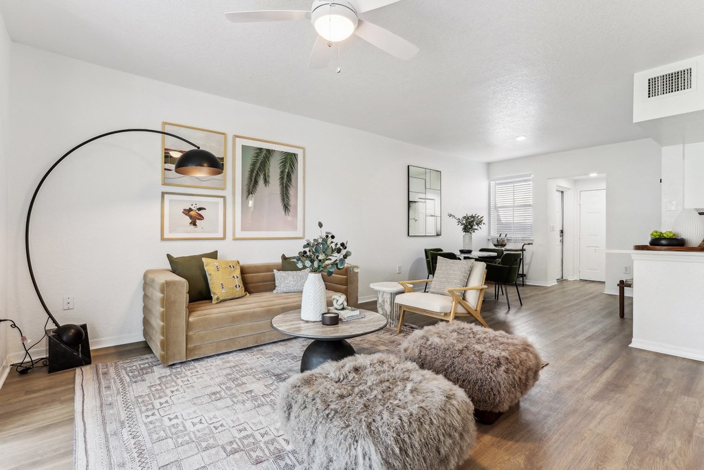 an open living room and dining room with a couch and chairs