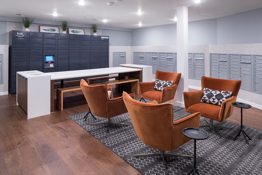 a conference room with leather chairs and a table and lockers