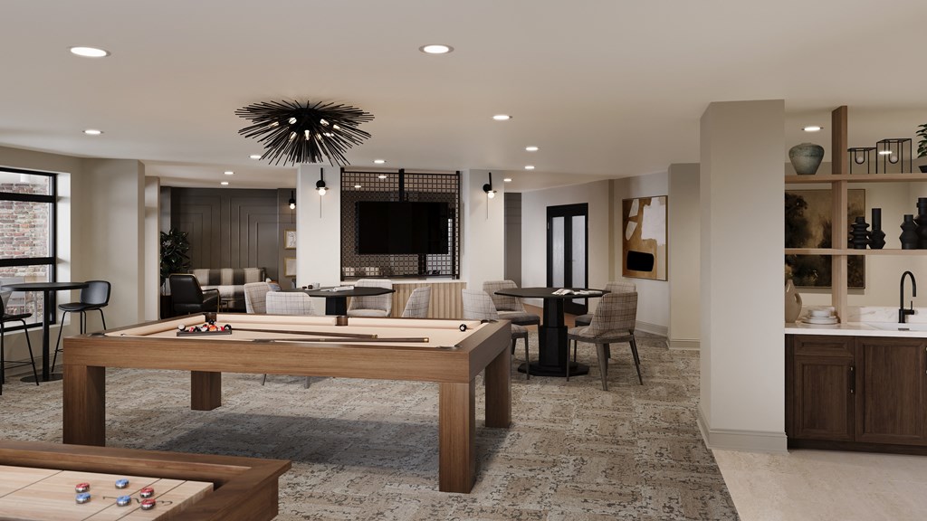 a recreation room with a pool table and a bar