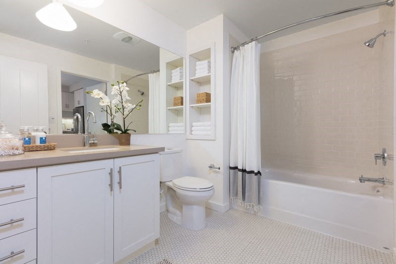 a bathroom with a sink toilet and a shower