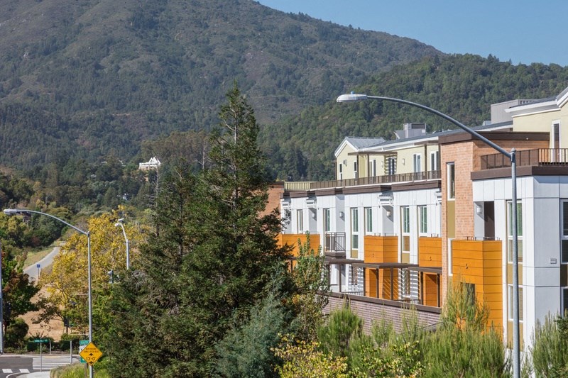 a view of a building with a mountain in the background