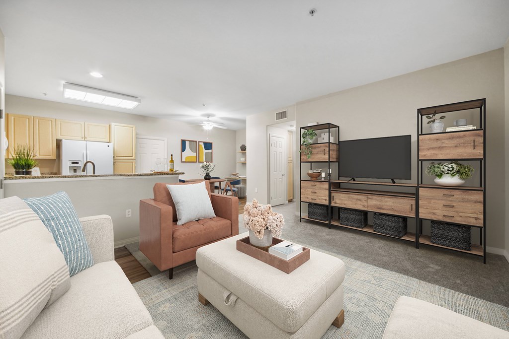 A living room with a couch, chair, and television.
