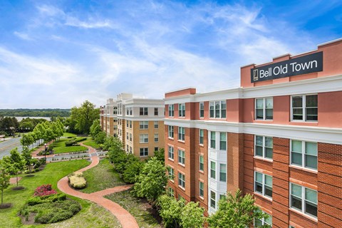 Bell Old Town is a red brick building with a green lawn in front.