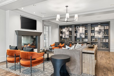 A modern living room with a fireplace and a television.