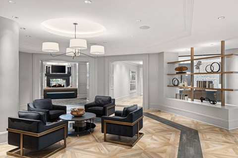 A living room with a black and gold coffee table.