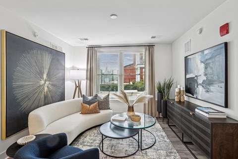 a living room with a white couch and a table