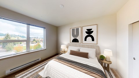 A bedroom with a large bed and a window overlooking a tree-filled landscape.