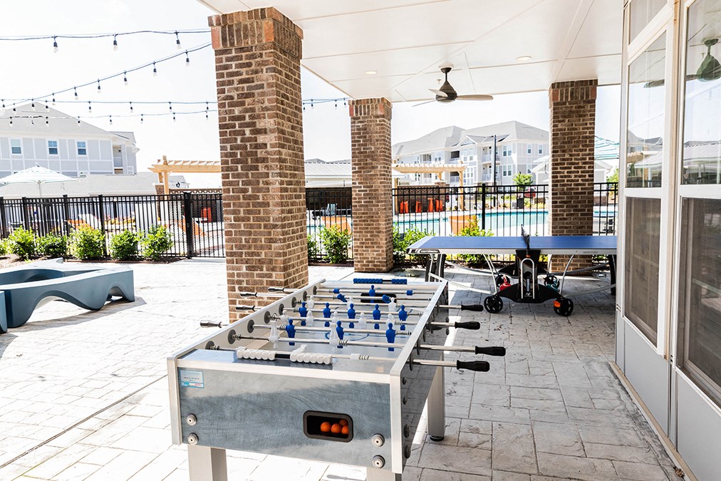 exterior game area with fuse ball and ping pong table