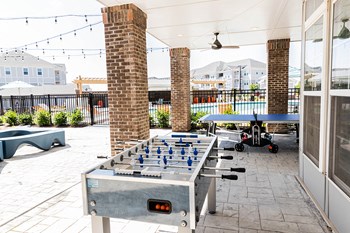 exterior game area with fuse ball and ping pong table - Photo Gallery 18