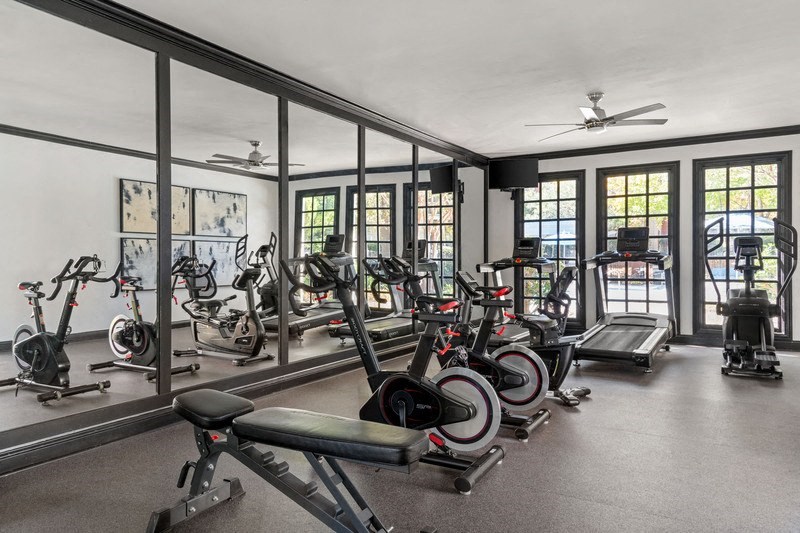 a gym with a lot of exercise equipment