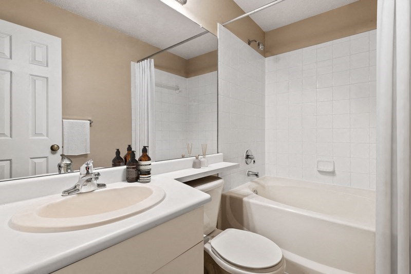a bathroom with a sink toilet and bathtub