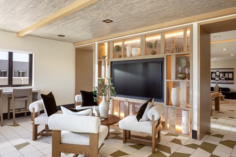 A living room with a television and a checkered floor.