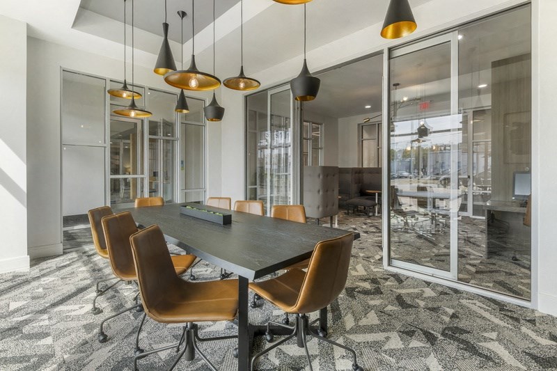 a conference room with a large table and chairs