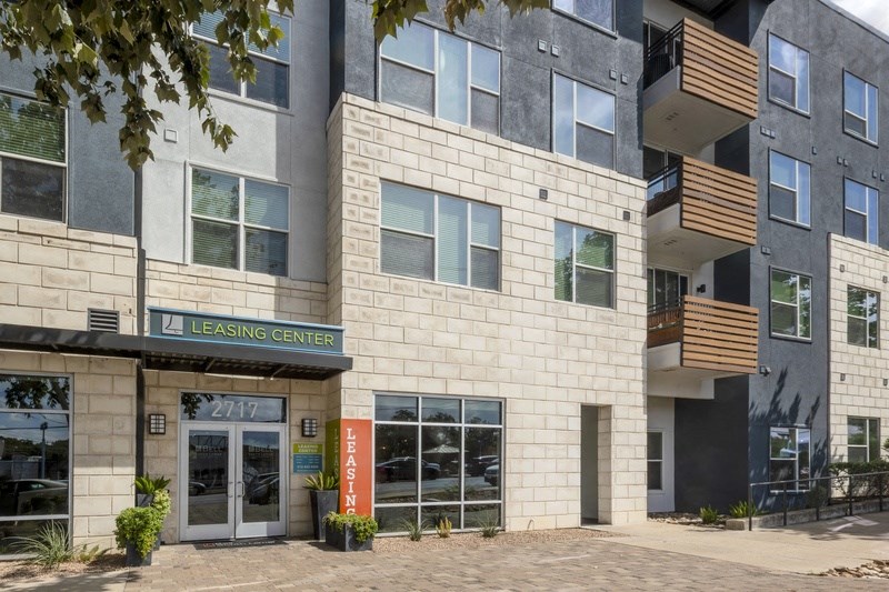 an exterior view of the leasing center of an apartment building