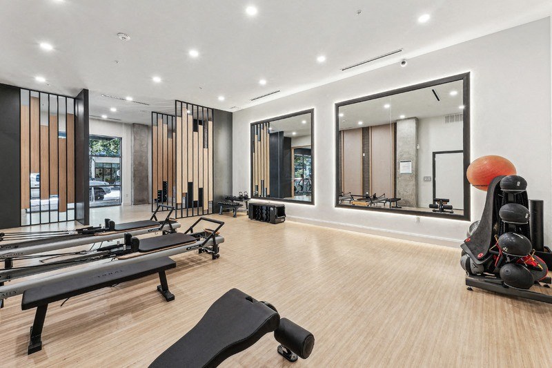 the gym is equipped with treadmills and other fitness equipment