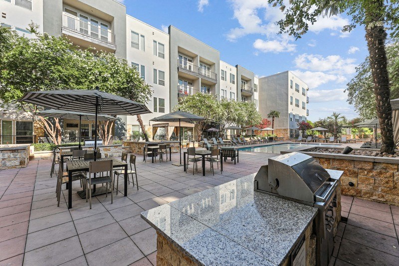 our apartments have a large patio with a grill and tables