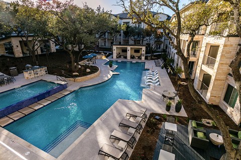 a view of the pool from the top of the building