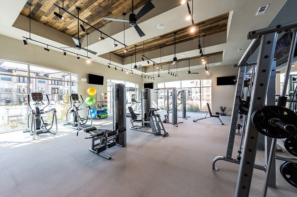 the gym at the flats at big tex apartments