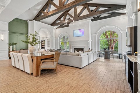 a living room with a fireplace and a wooden floor