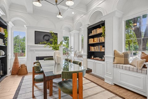 a dining room with a table and chairs and a fireplace