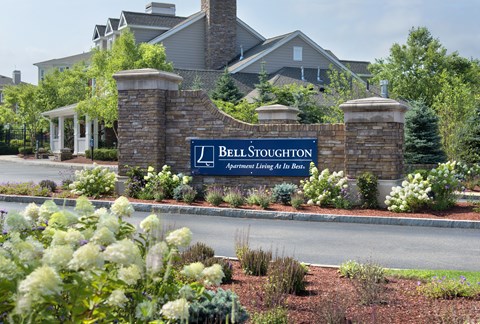 the sign for bell stadium at the entrance of the building