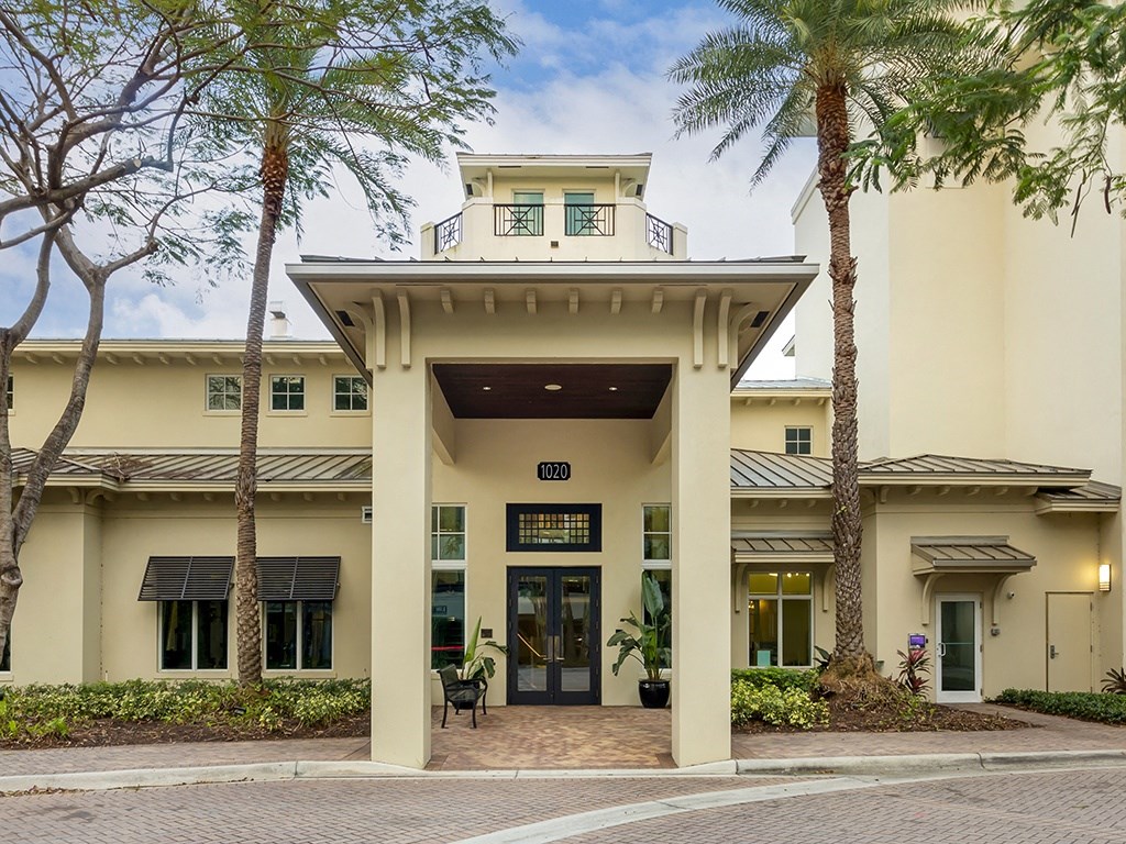 a building with palm trees in front of it