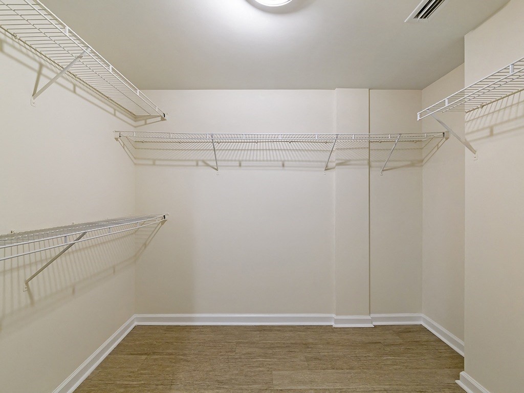 a spacious walk in closet at the oxford at estonia apartments in san antonio