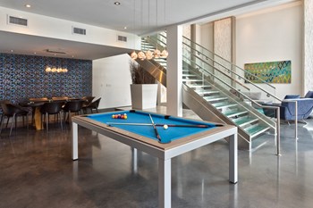 resident two story lounge with seating  and pool table - Photo Gallery 7