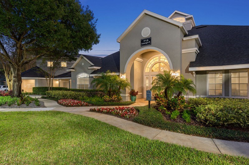 a home with a walkway in front of it