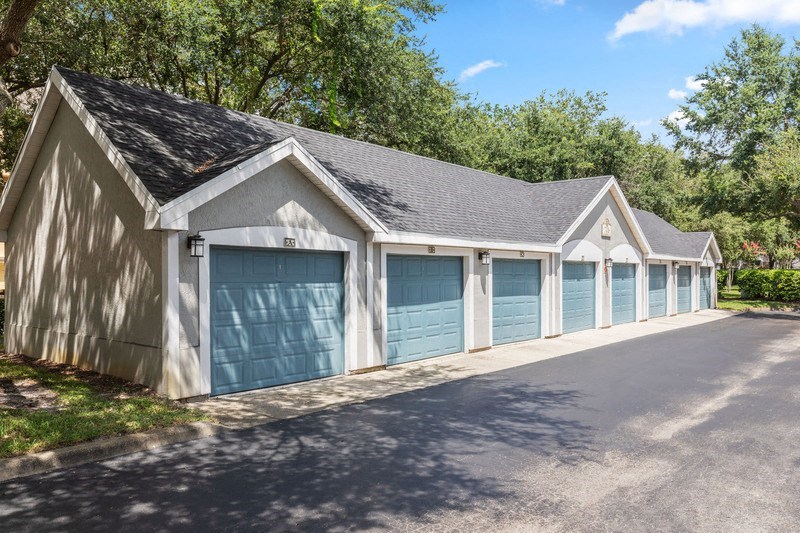 a row of garages with blue doors