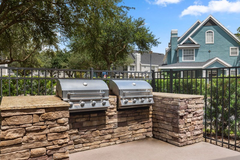 our apartments have an outdoor kitchen with a grill and bbq