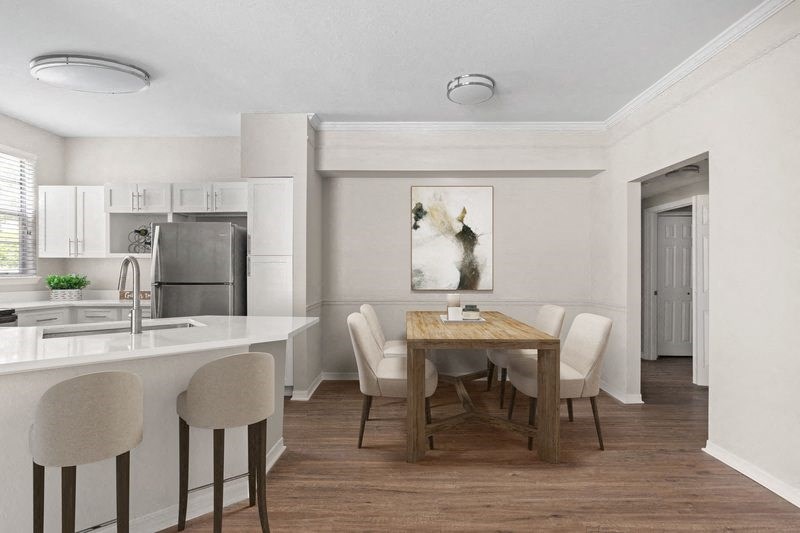 a kitchen and dining area in a 555 waverly unit