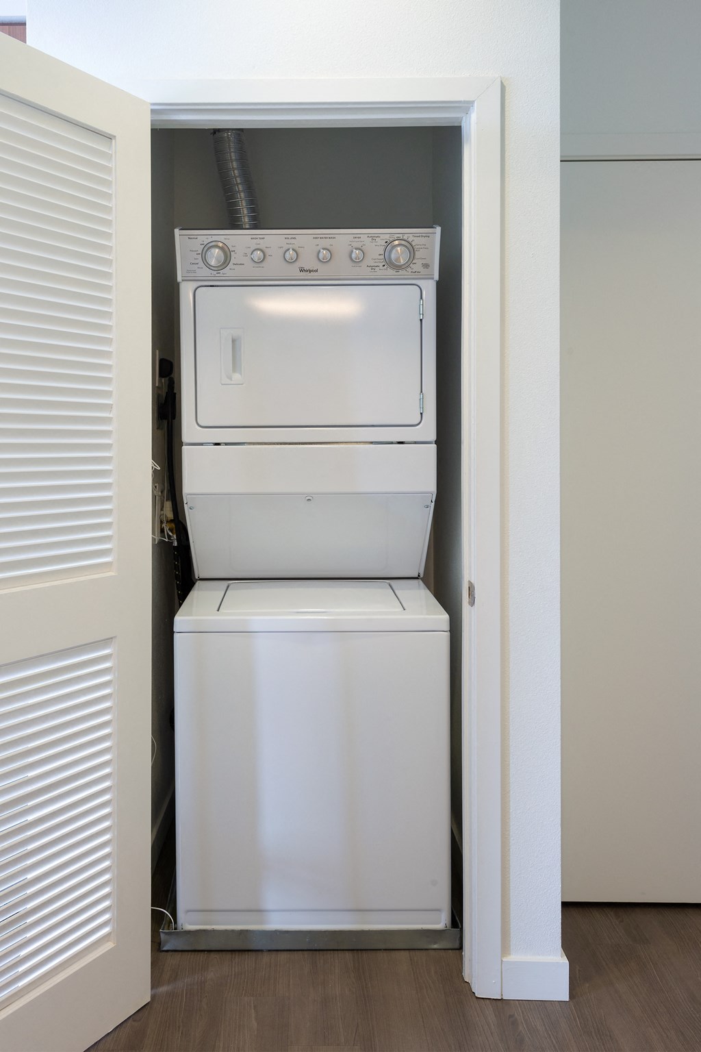 an empty laundry room with a washer and dryer