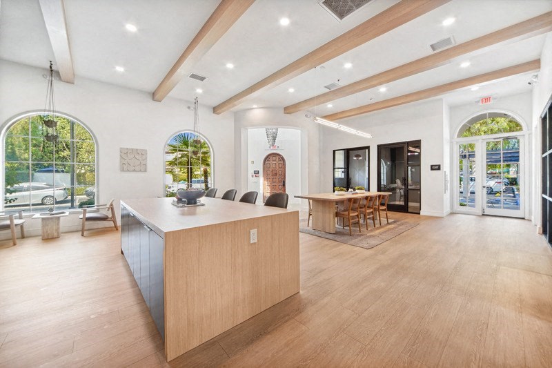 the house has an open floorplan with a large kitchen and living room