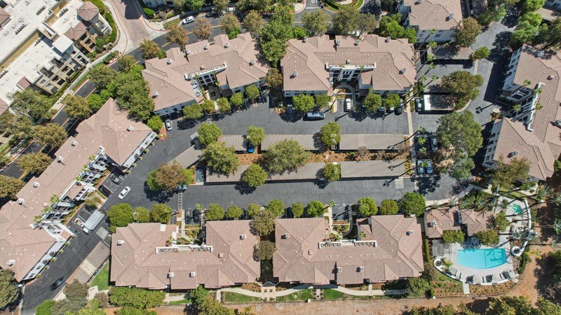 an aerial view of a neighborhood with houses and trees