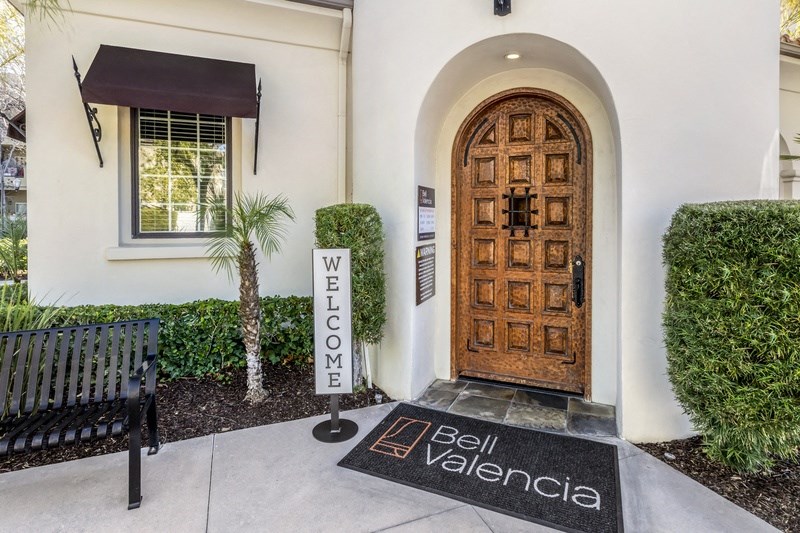 the entrance apartments with a wooden door