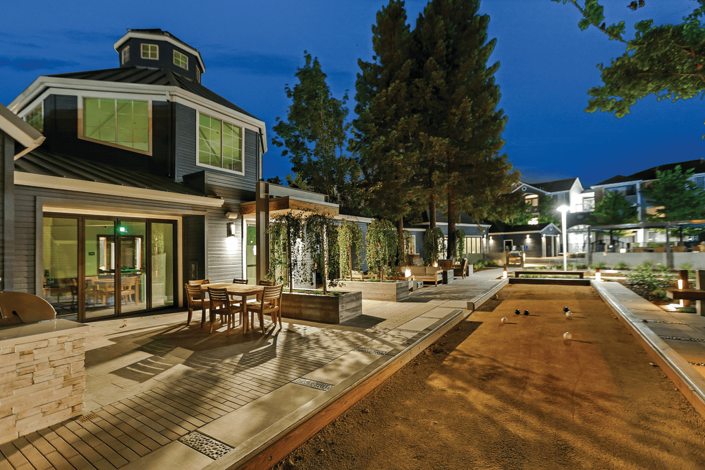 A modern house with a patio and a pool table.