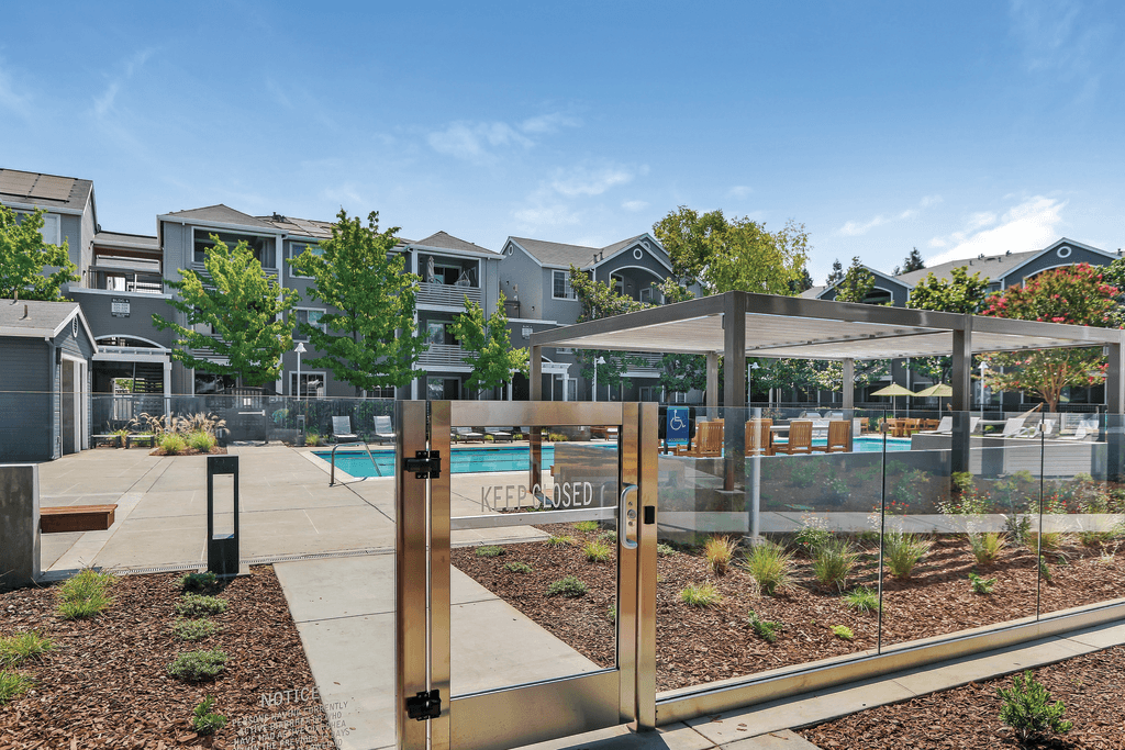 A gated community with a pool and a sign that says "KEEP CLEAR".