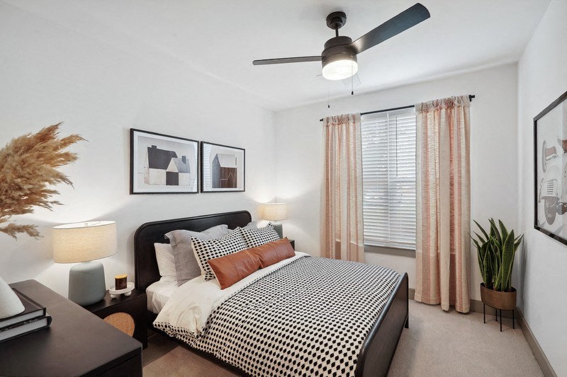 a bedroom with a bed and nightstand