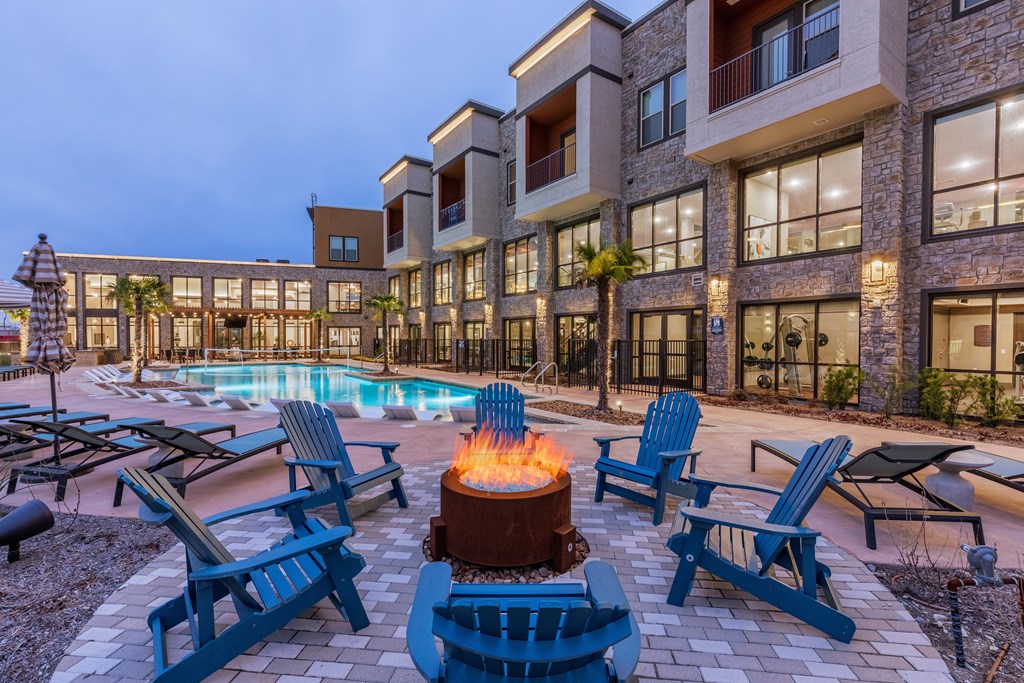 the preserve at ballantyne commons commons pool and fire pit at night
