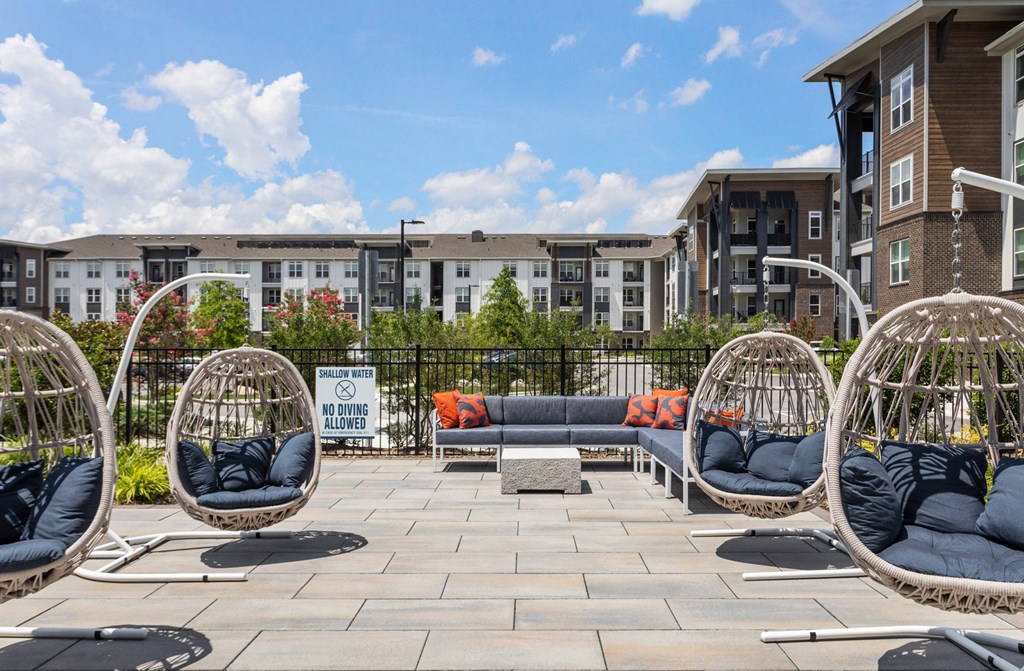 A patio area with a sign that says